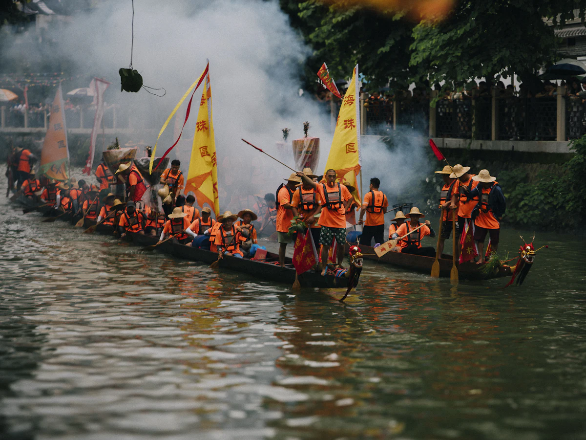 Traditional dragon boats with yellow flags on a river