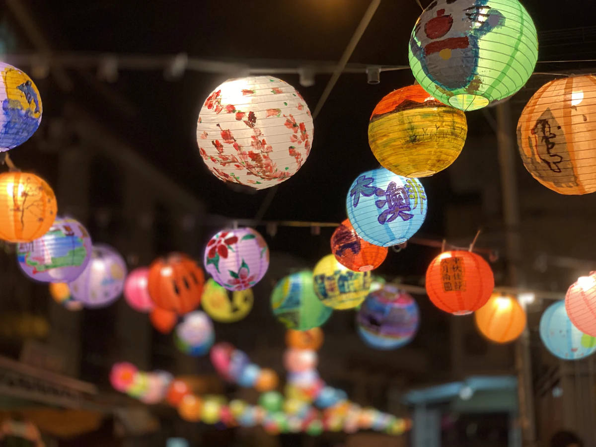 Colourful round lanterns glowing at night